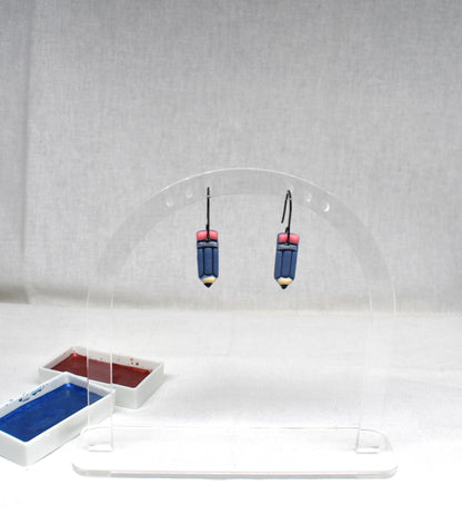 Handmade blue polymer clay pencil earrings with pink eraser top, gold ferrule band and yellow tip on matte black hooks