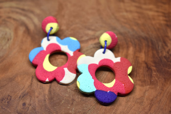 Handcrafted polymer clay large open flower drop earrings in bold multicolour including red, blue, yellow and purple with pink stud